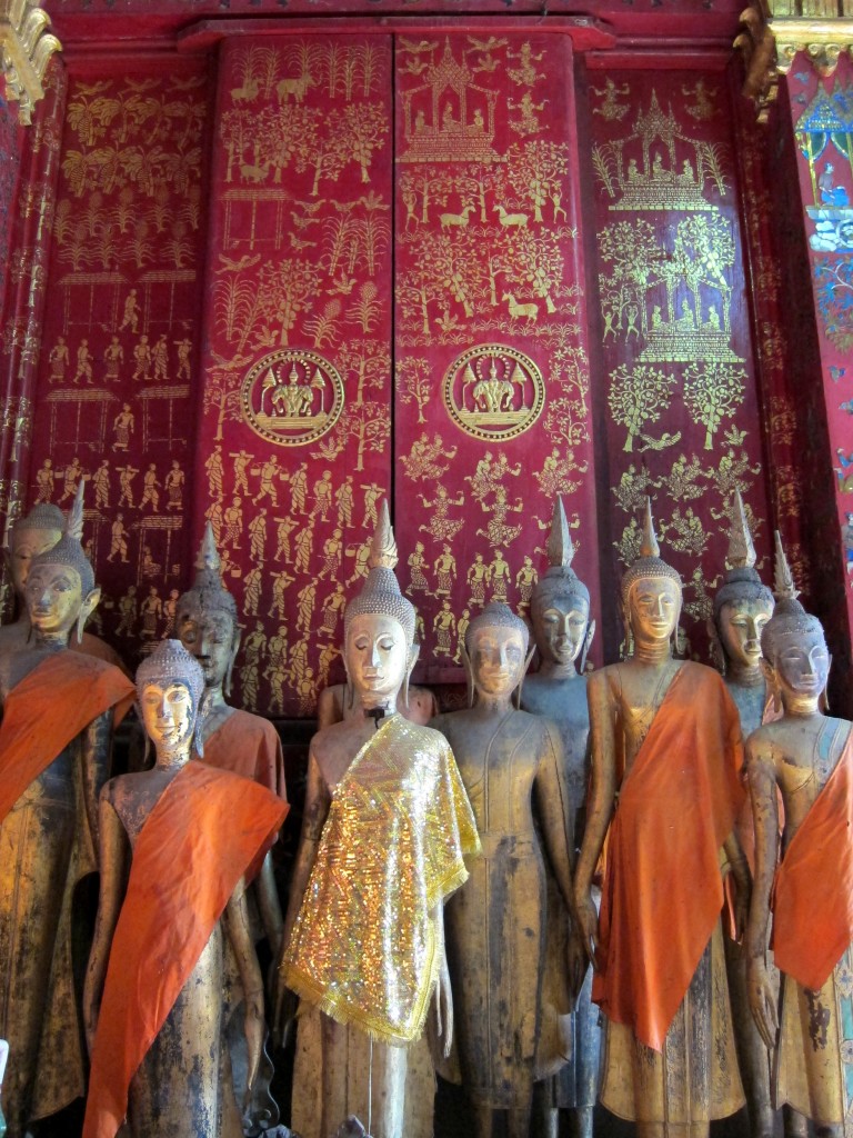 Golden Buddhas in Wat Xieng Thong, an important temple in Luang Prabang, Laos