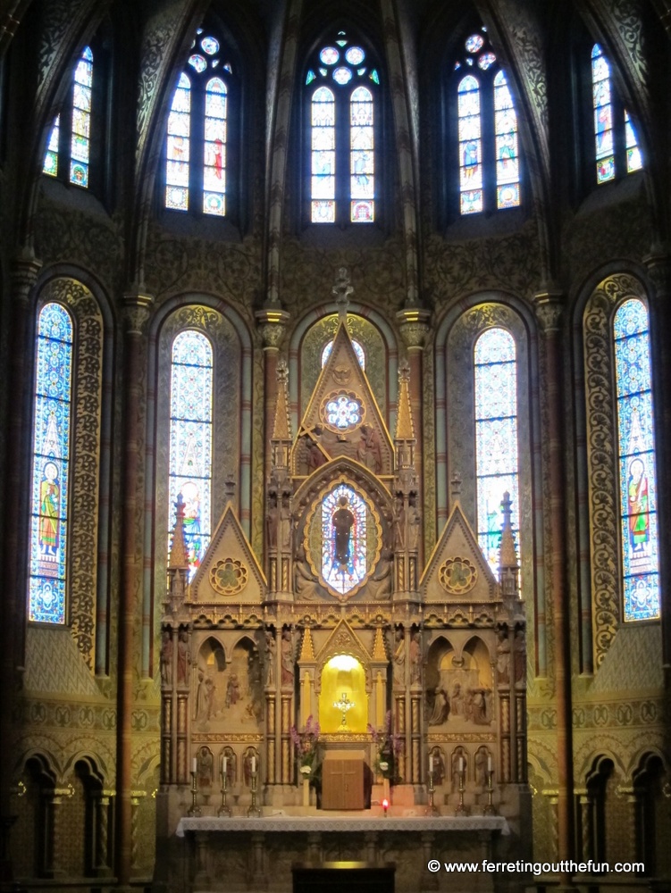Altar and stained glass windows of Matthias Church in Budapest