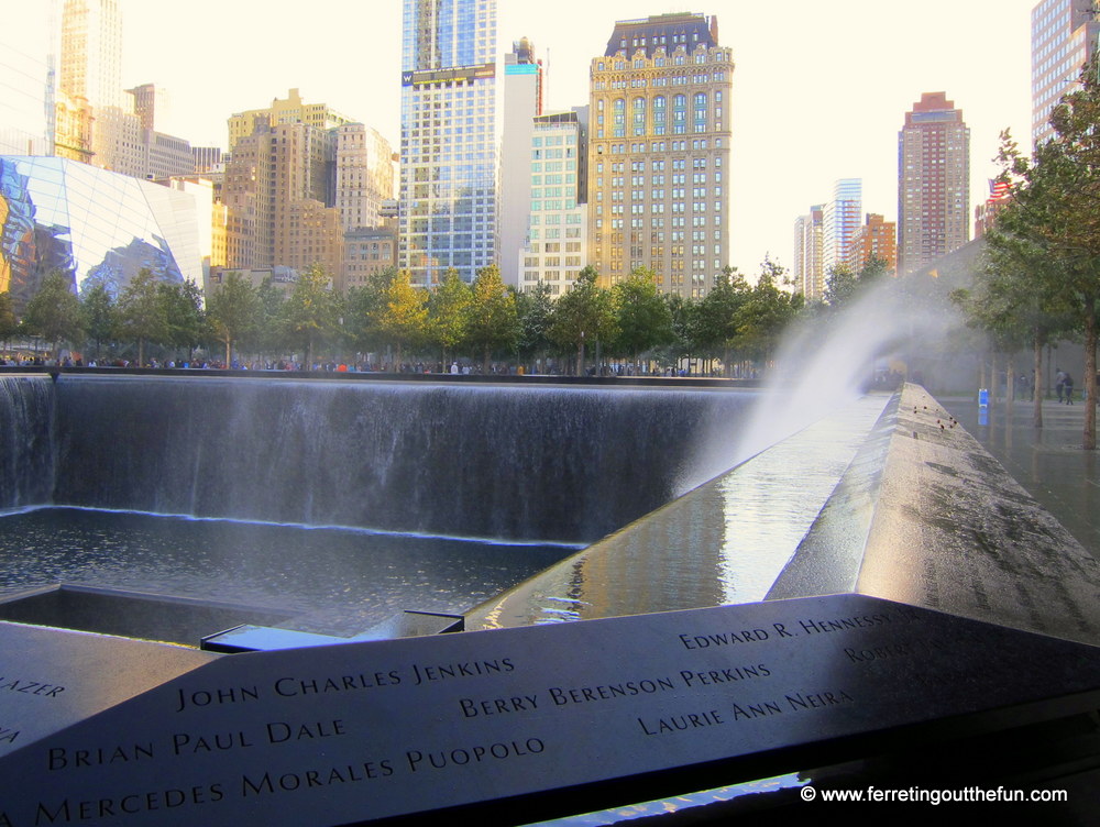 Wind sprays water over the memorial walls.