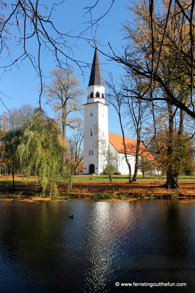 A picturesque white church in Sigulda, Latvia on a bright autumn day