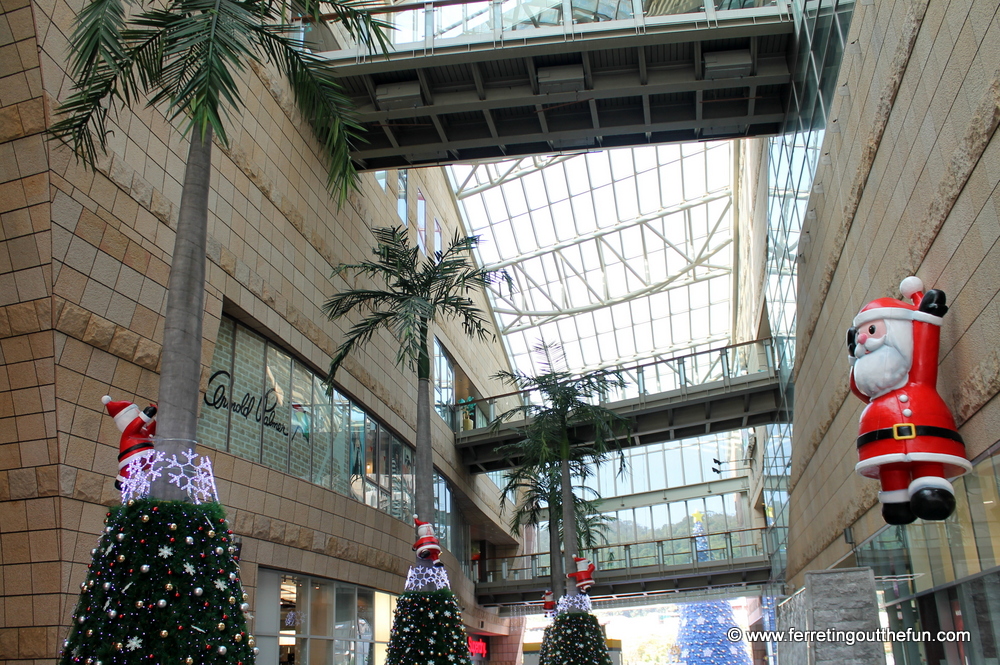 santas in palm trees