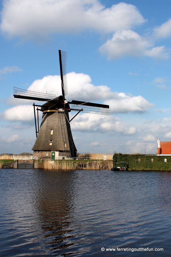 An old Dutch windmill next to a canal in Holland