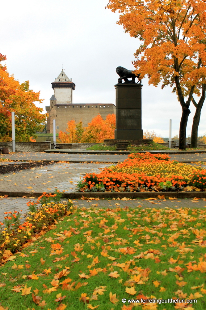 A Swedish lion stands in front of a medieval castle in Narva, Estonia