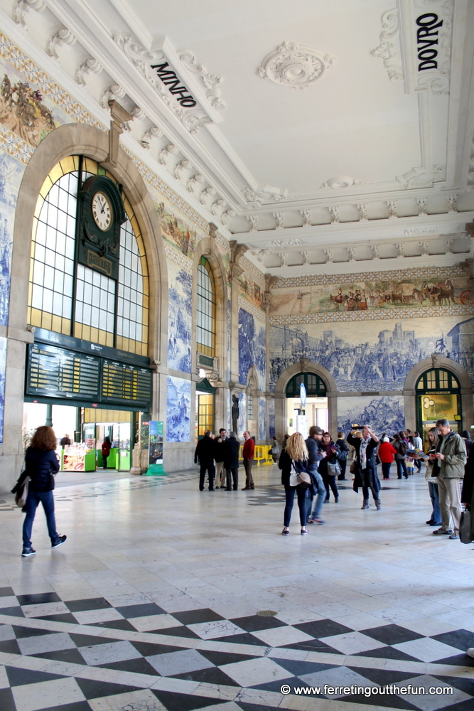 Blue and white azulejo tiles cover the interior of Sao Bento Railway Station in Porto, Portugal