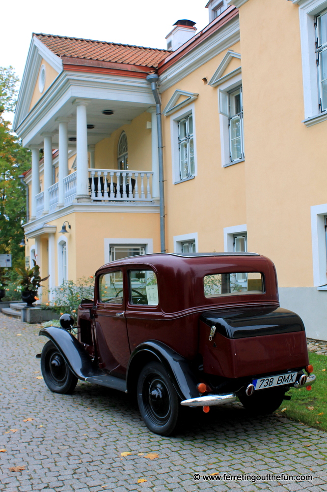 An antique car parked next to Vihula Manor in Estonia