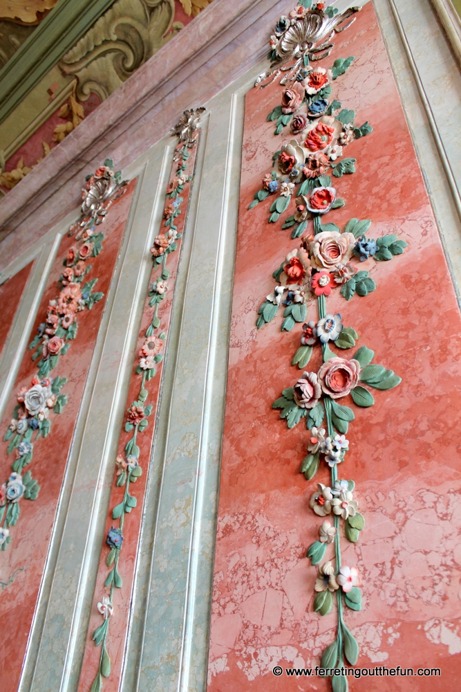 Stucco roses adorn pink marble walls inside Rundale Palace, Latvia