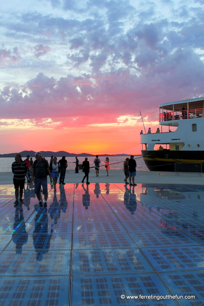 A spectacular pink sunset can be seen from the Monument to the sun in Zadar, Croatia