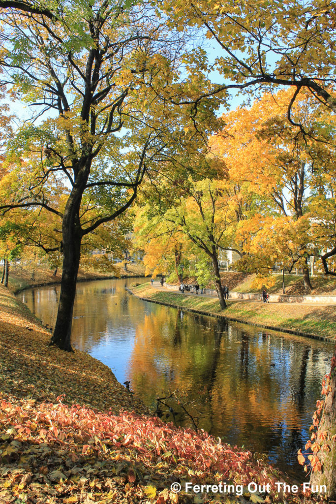 Golden autumn foliage frames the Riga City Canal in Latvia