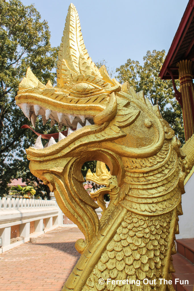 Golden dragons guard a temple in Vientiane, Laos