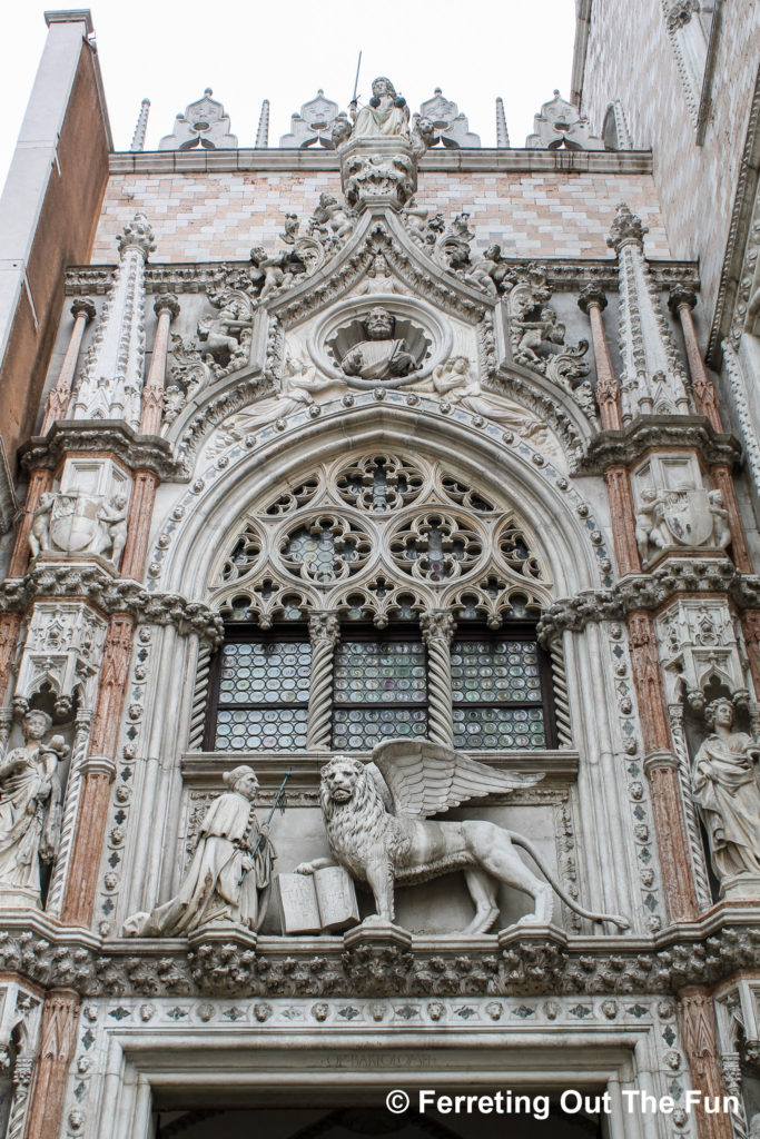 Porta della Carta, a 15th-century Gothic gate to the Doge's Palace in Venice Italy. It features the winged lion of St Mark.