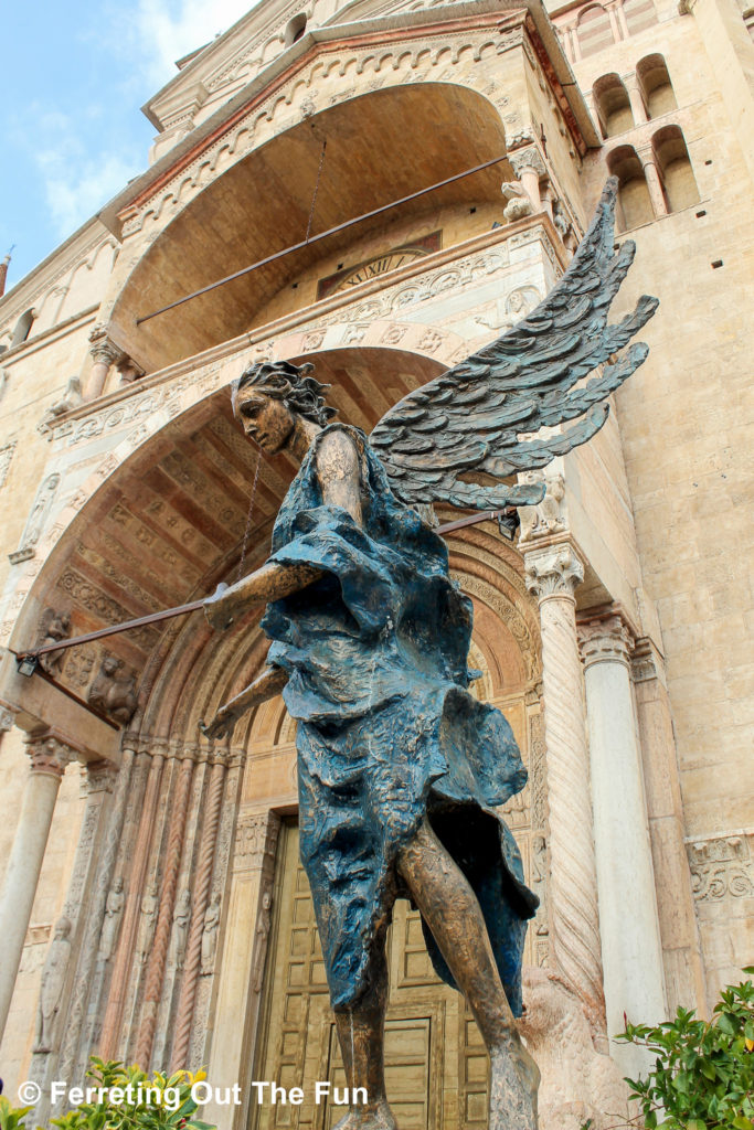 An angel welcomes visitors to the cathedral in Verona, Italy