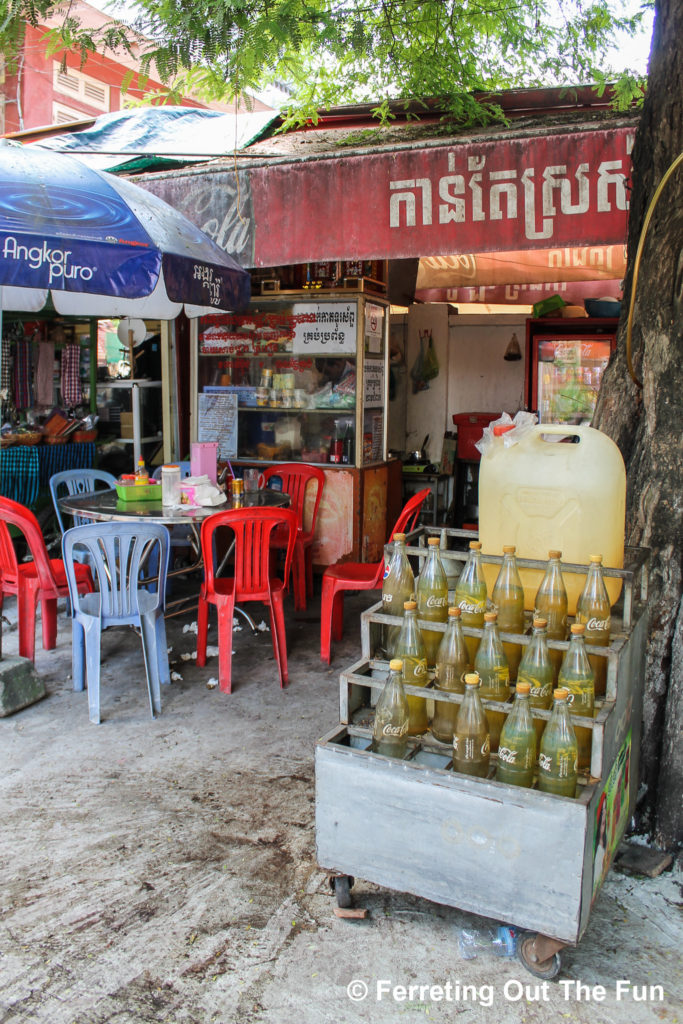 A motorbike petrol station on a sidewalk of Phnom Penh, Cambodia