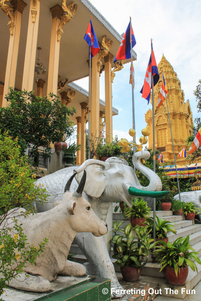 Elephant and cow statues guard Wat Ounalom  in Phnom Penh, Cambodia