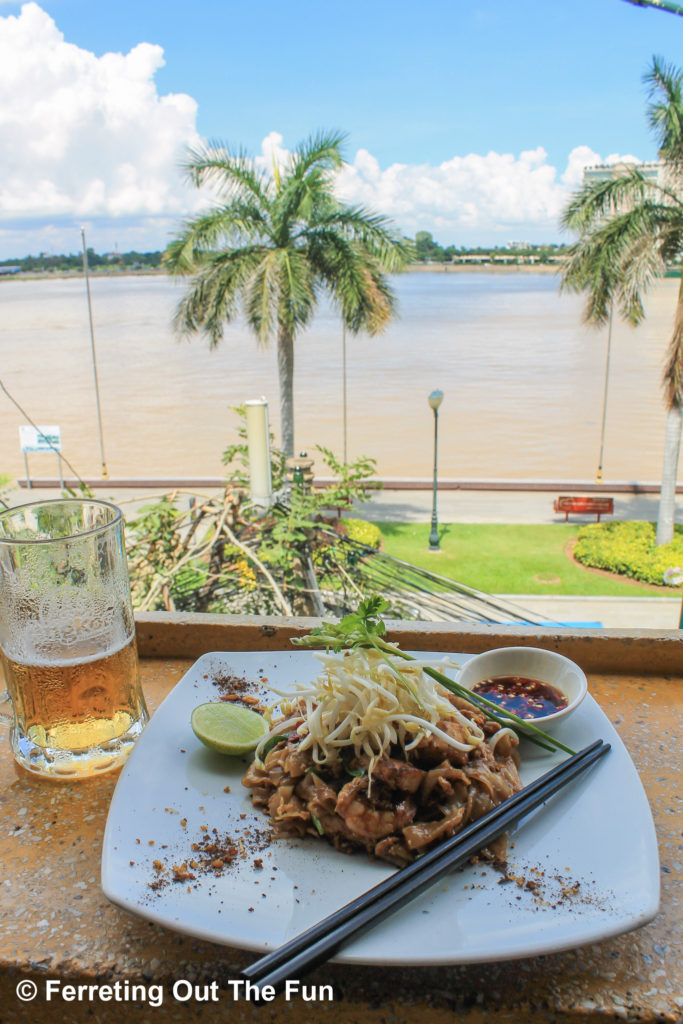 Enjoying shrimp pad thai by the Mekong river in Phnom Penh, Cambodia