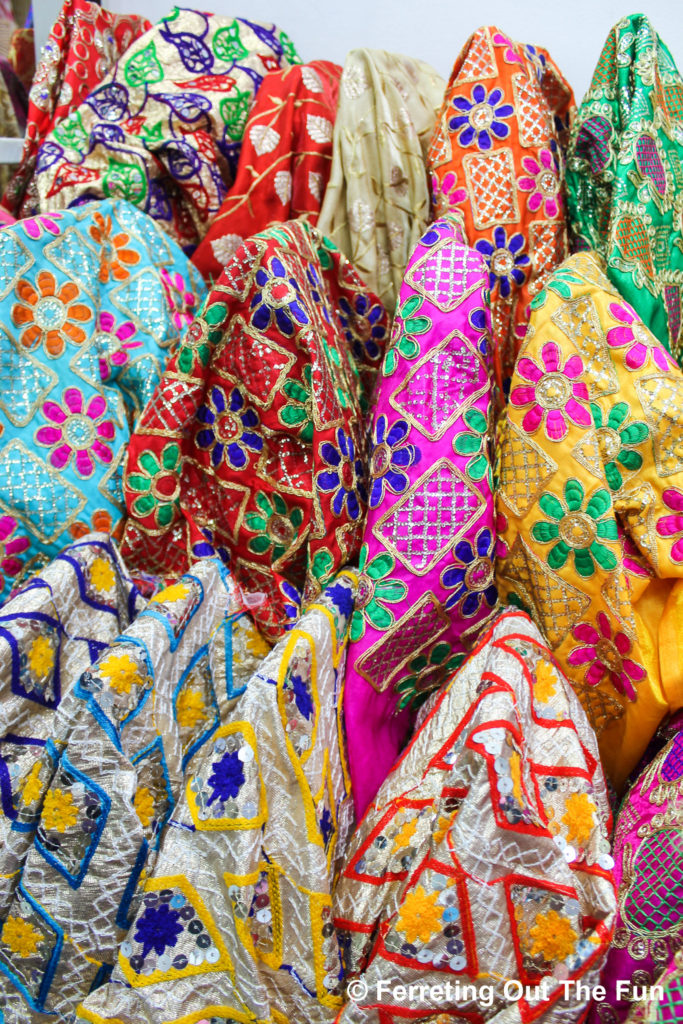 Fabric shopping for traditional Indian textiles in Little India, Bangkok