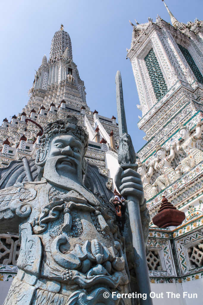 A Chinese warrior stands guard at Wat Arun in Bangkok