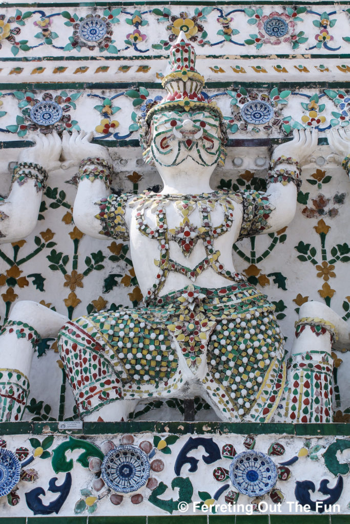 Shards of broken porcelain plates adorn the facade of Wat Arun in Bangkok