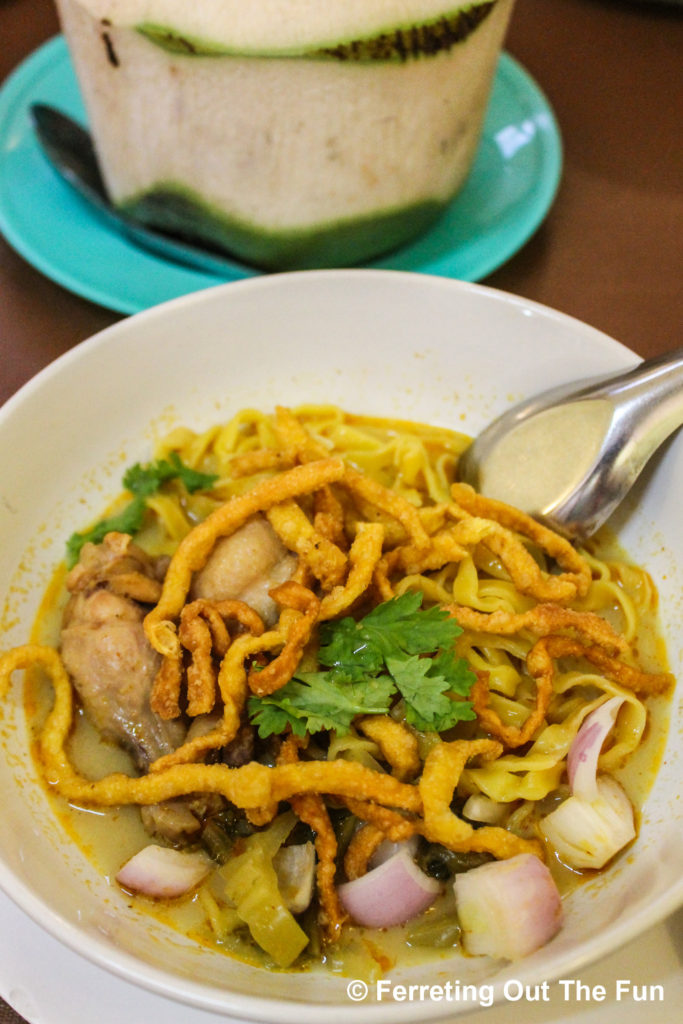 Khao soi, a delicious Northern Thai curry. It has chicken and egg noodles in a spicy sweet coconut milk broth and is topped with fried noodles for a wonderful crunch.