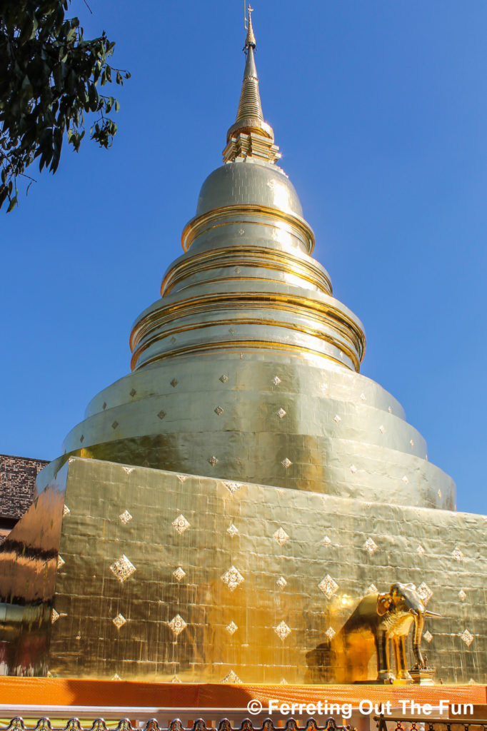 Golden chedi and elephant on the grounds of Wat Phra Singh, one of the most important Buddhist temples in Chiang Mai, Thailand