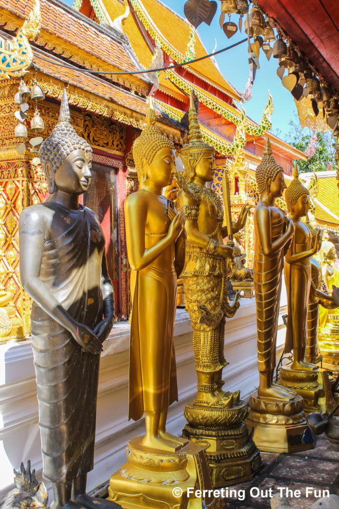 A row of Standing Buddhas line the pilgrim's path of Wat Doi Suthep in Chiang Mai, Thailand
