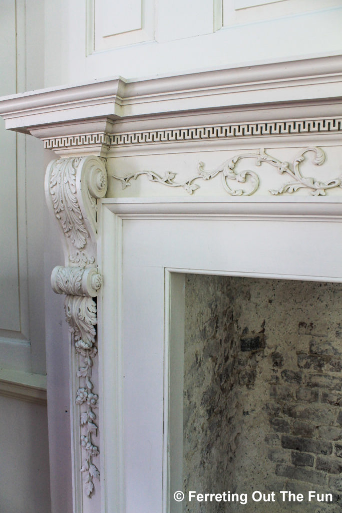 An elaborately carved fireplace inside Hampton Plantation, South Carolina