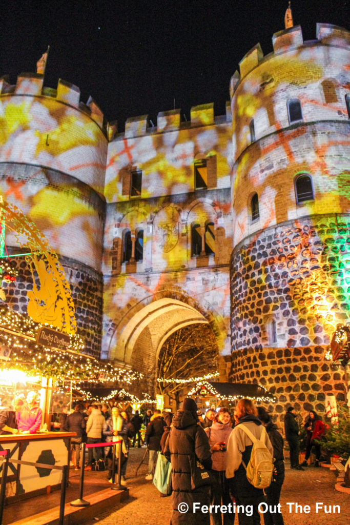 Holiday illuminations on a medieval gate in Cologne, Germany