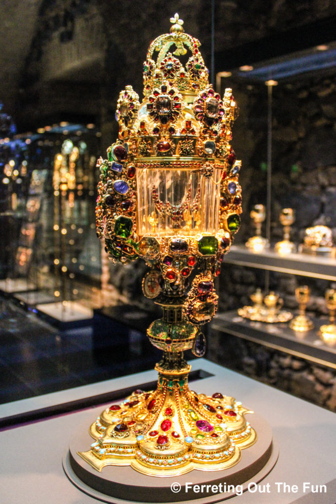 An elaborate monstrance of gold and precious gemstones inside the Cologne Cathedral Treasury