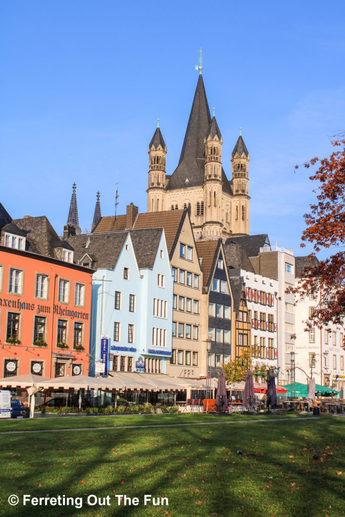 Beautifully restored facades of medieval houses and Great St Martin Church in Cologne, Germany.