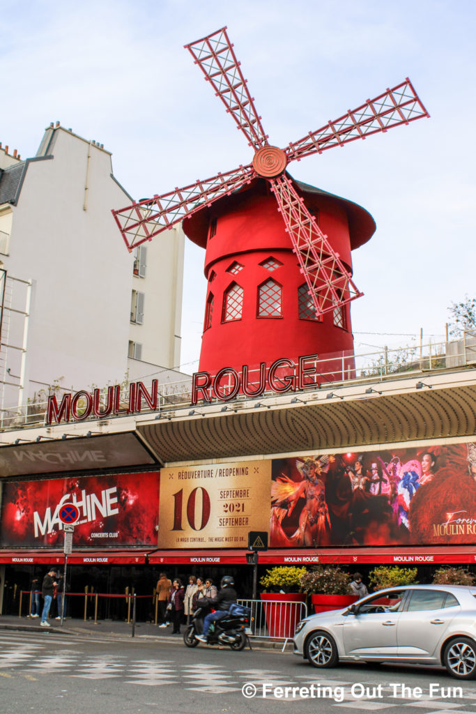 The iconic red windmill of the Moulin Rouge cabaret in Paris.
