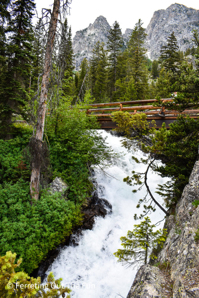 Hiking to Hidden Falls, a 100 foot cascading waterfall next to Lake Jenny in Grand Teton National Park, Wyoming