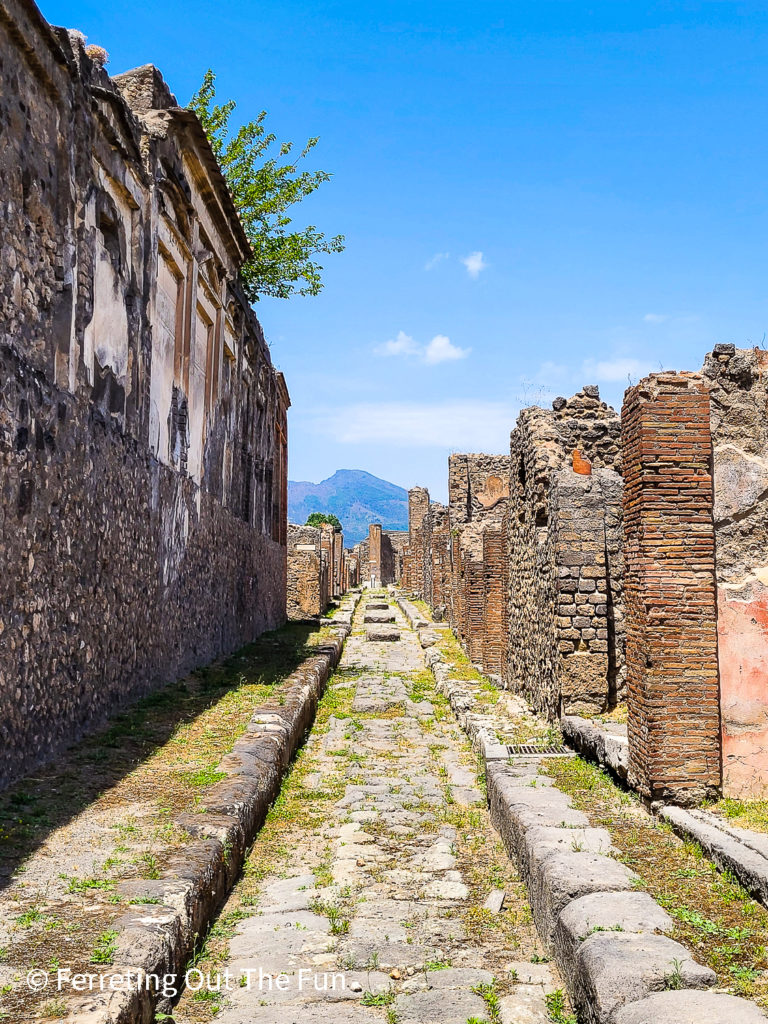 Walking down a cobblestone street of Pompeii, Italy