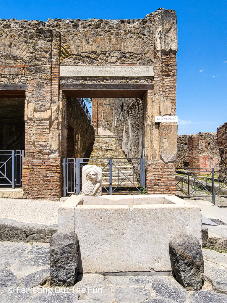 Well preserved ruins and a working fountain at Pompeii, Italy