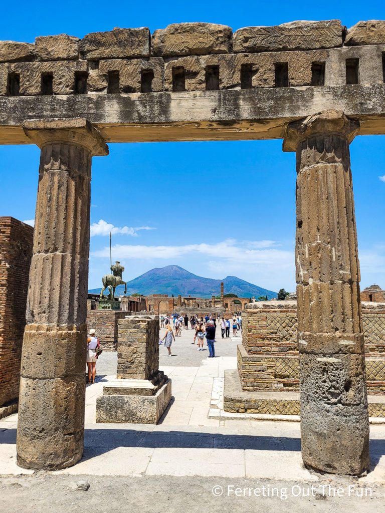 Vesuvius looms in the distance behind the Pompeii ruins. This would have been the Roman Forum in the center of the city.