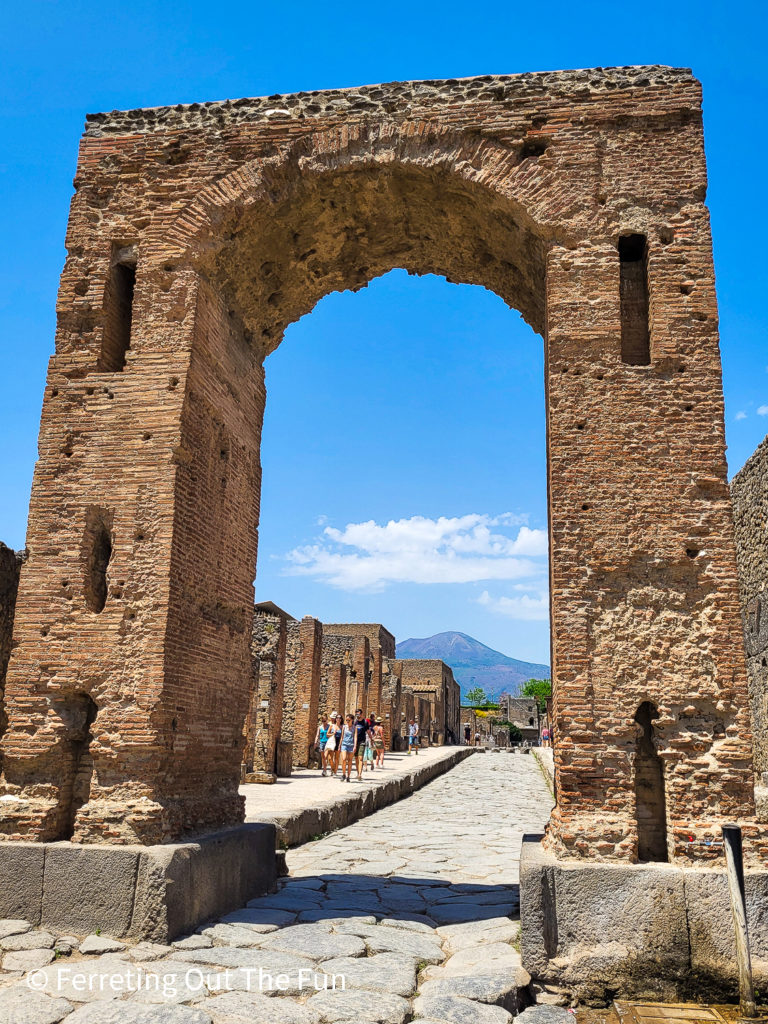 Original entrance gate to the ancient city of Pompeii. The fountain next to the gate still provides fresh drinking water.