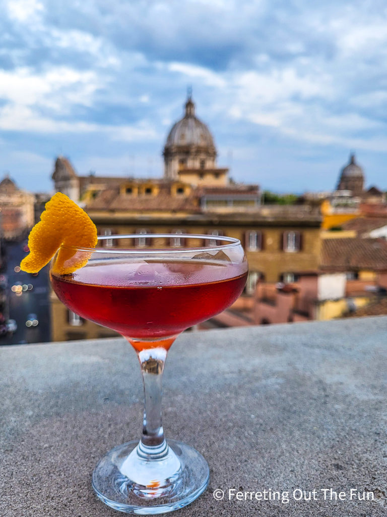 Sipping a cocktail at a rooftop bar in Rome