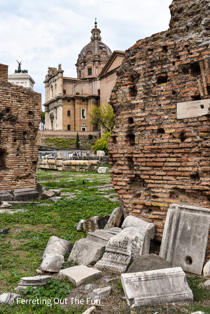Bits of broken marble and ancient brick walls are all that's left of the Roman Forum in Rome