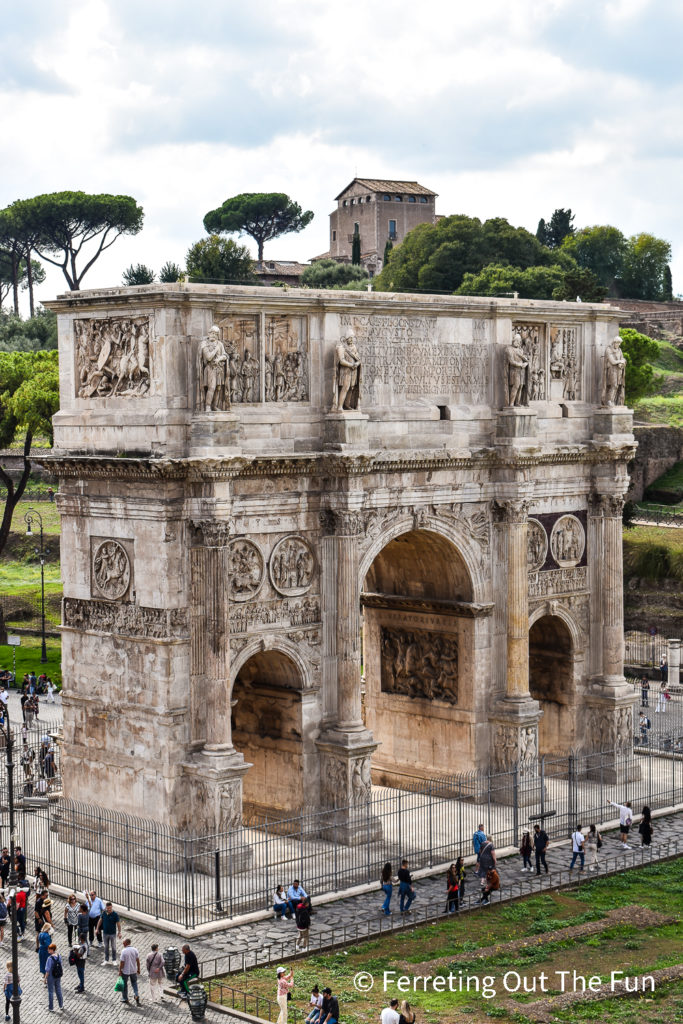 Looking out from the Colosseum at the Arch of Constantine. Palantine Hill is visible in the distance.