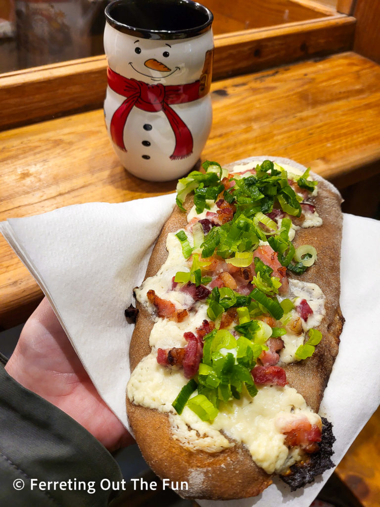 Wondering what to eat at the Munich Christmas market? Try a rahm schmankerl. This savory flatbread with cheese, bacon, and scallions is a great way to soak up all the gluhwein you'll be drinking.