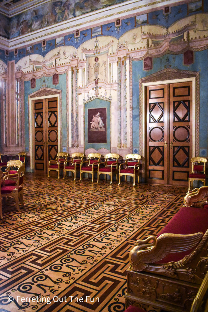 Intricate inlaid wood floors, gilded chairs, and beautifully painted walls inside the Munich Residenz Palace Museum