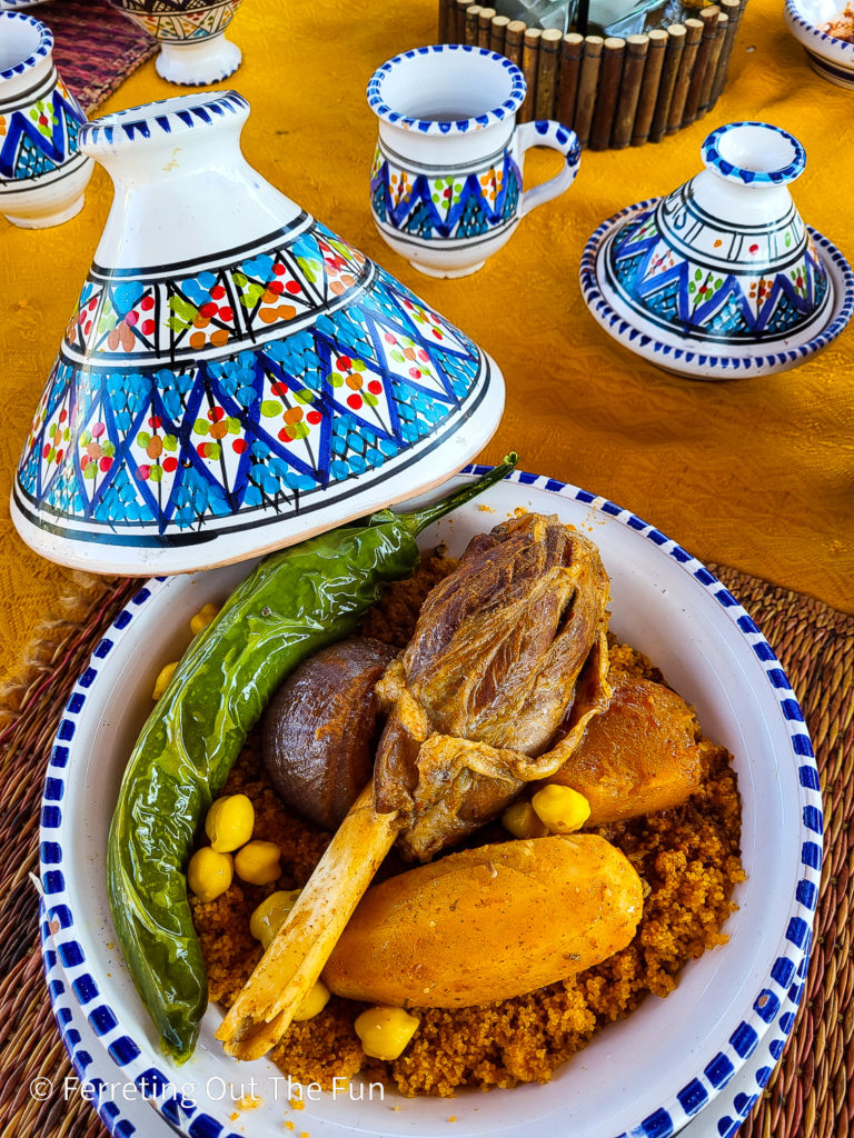 Lamb couscous with vegetables served in beautiful Tunisian pottery