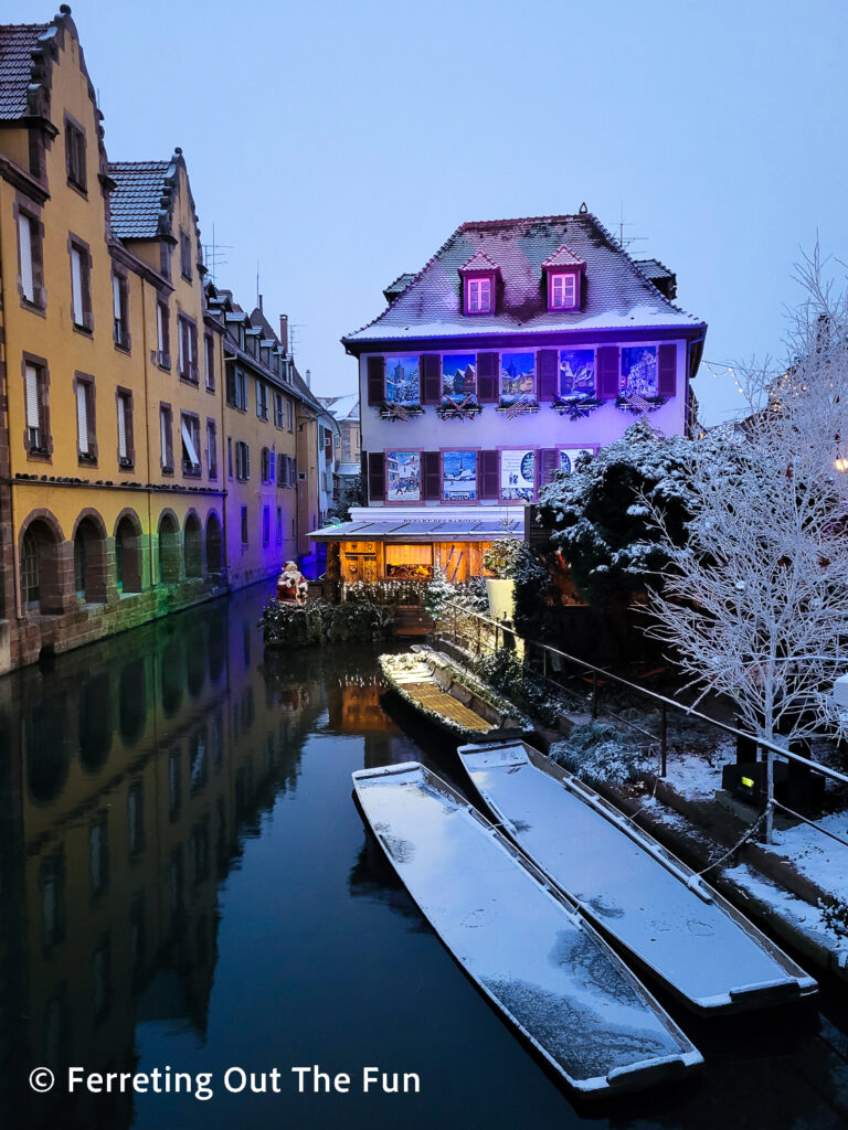 Winter reflections and holiday lights in Colmar, France