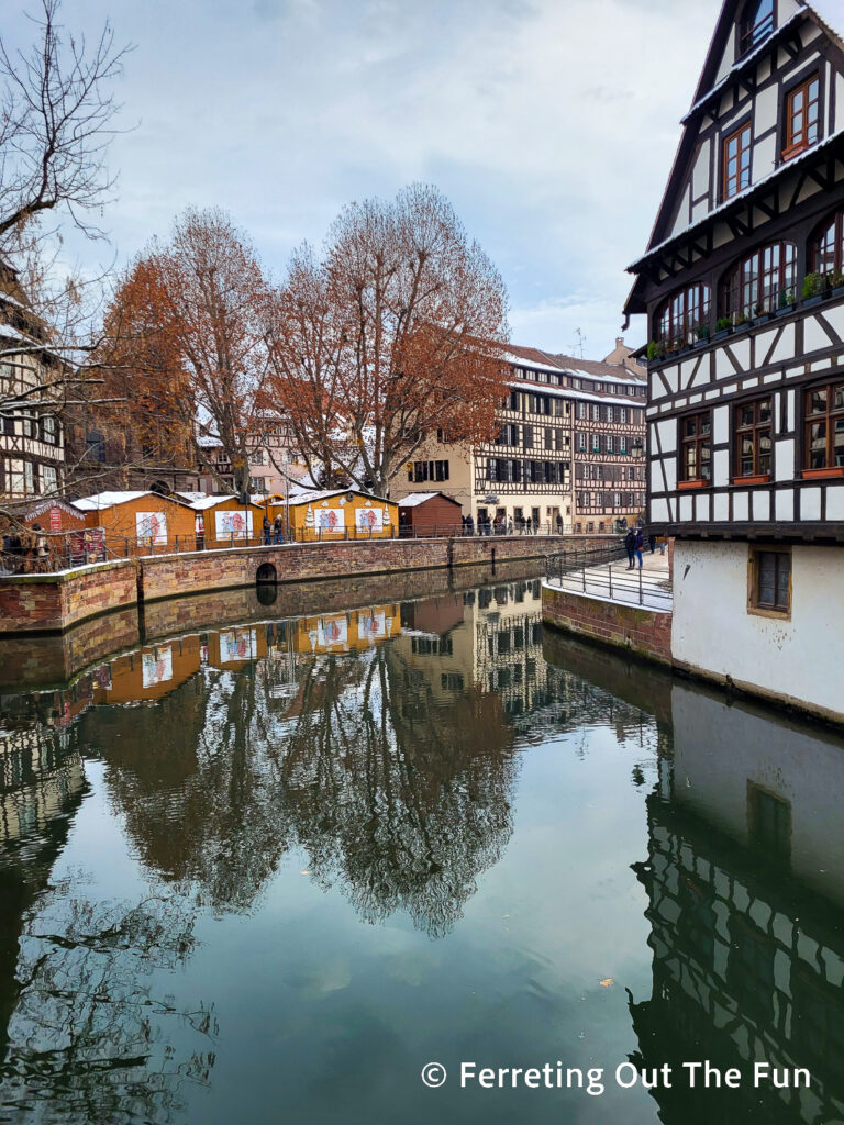 Strasbourg Christmas Market reflected in one of the city's pretty canals