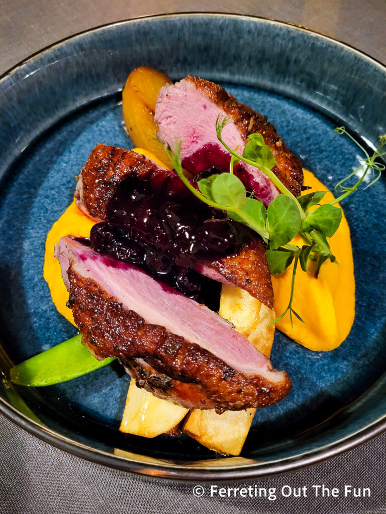 Roast duck breast with root vegetables, carrot puree, and Riga black currant balsam sauce at Petergailis restaurant in Riga, Latvia