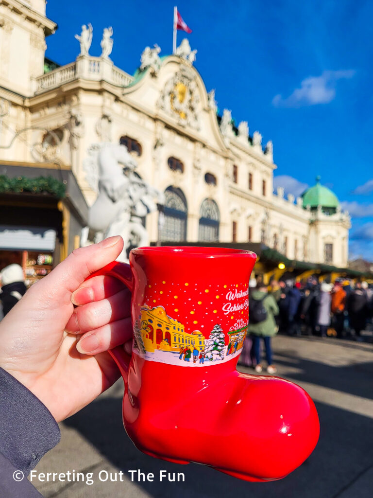 Adorable red boot gluhwein mug at Belvedere Palace Christmas Village, one of the incredible Vienna Christmas Markets