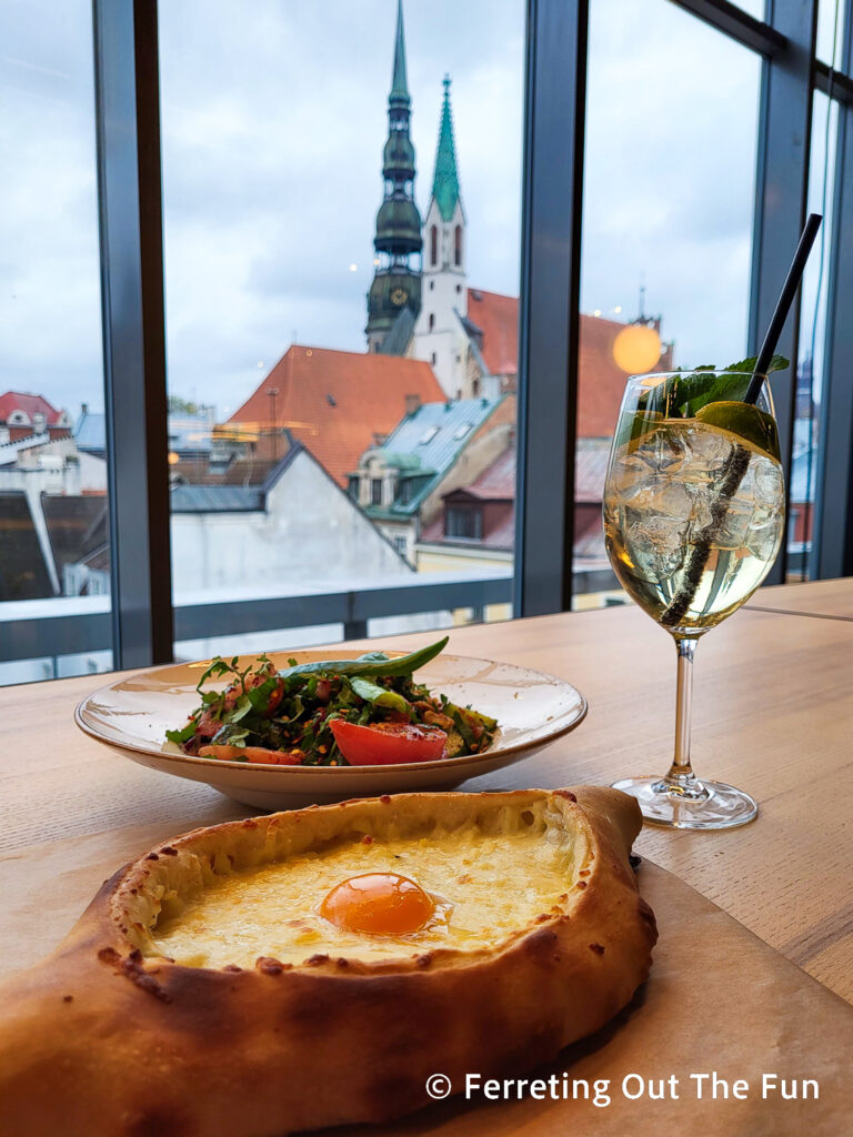 Georgian Khachapuri with a rooftop view of Old Riga at BURZMA food hall at Galerija Centrs