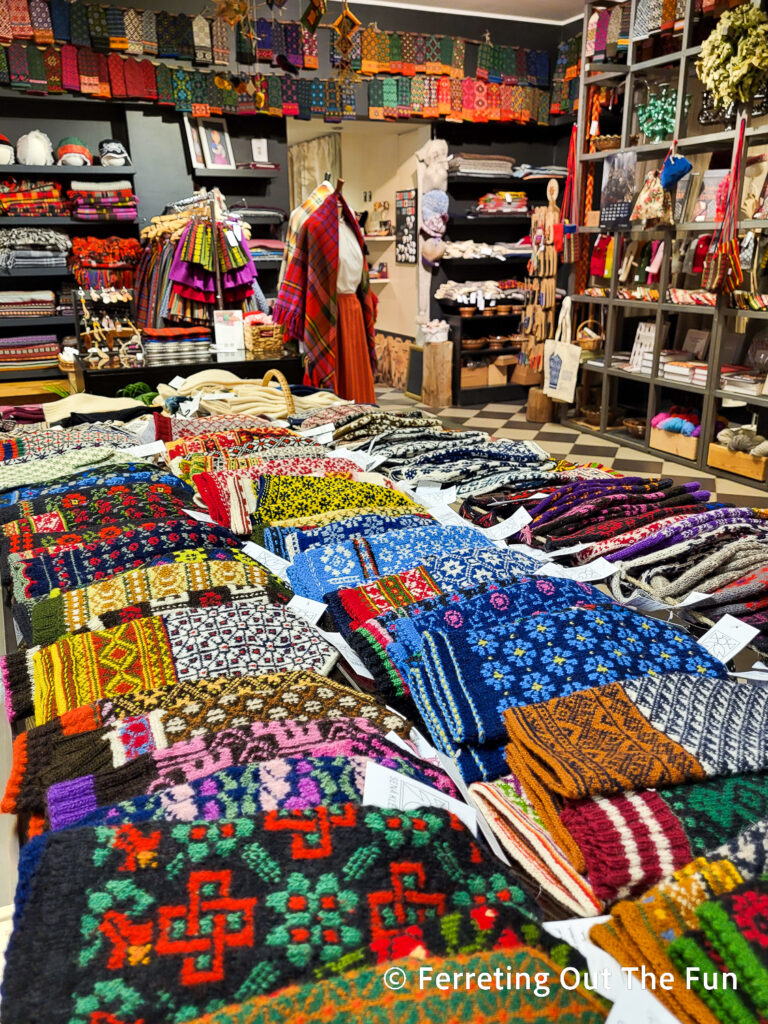 Colorful Latvian mittens and traditional folk costumes at Sena Klets shop in Riga, Latvia