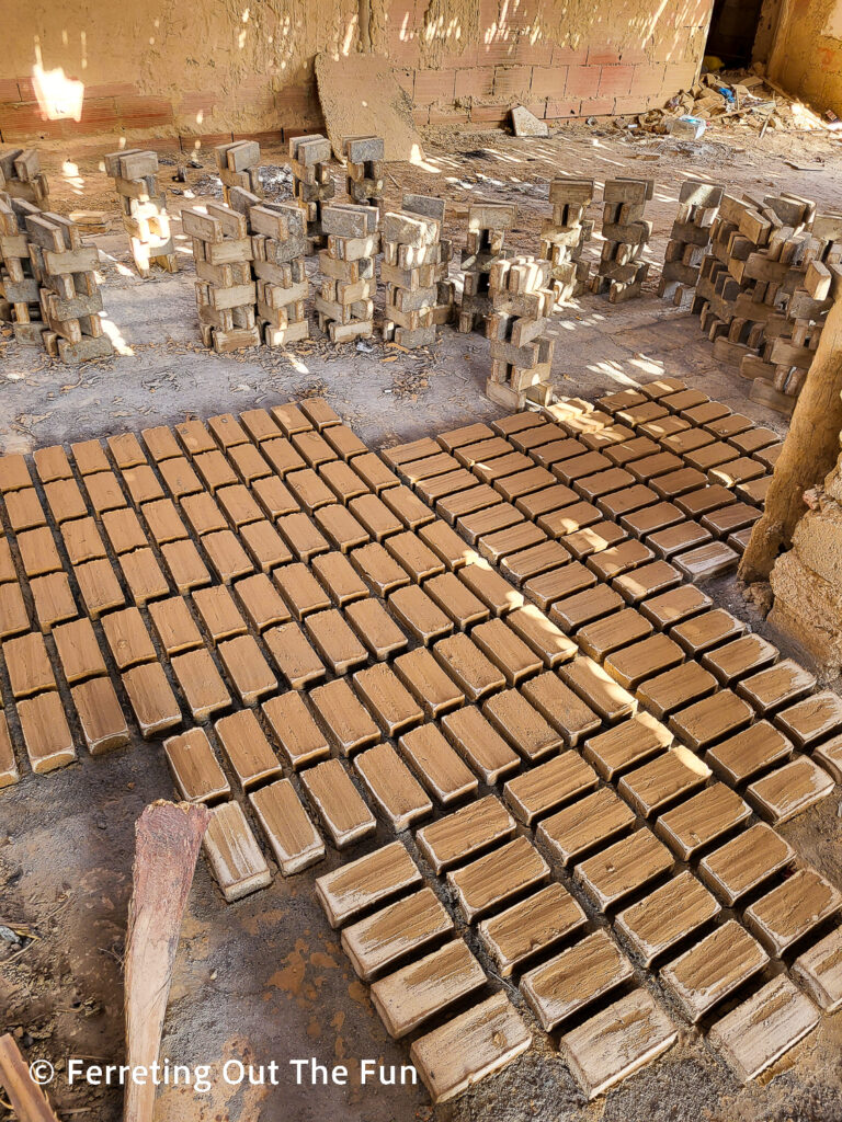 Handmade bricks waiting to be fired at a traditional workshop in Tozeur, Tunisia