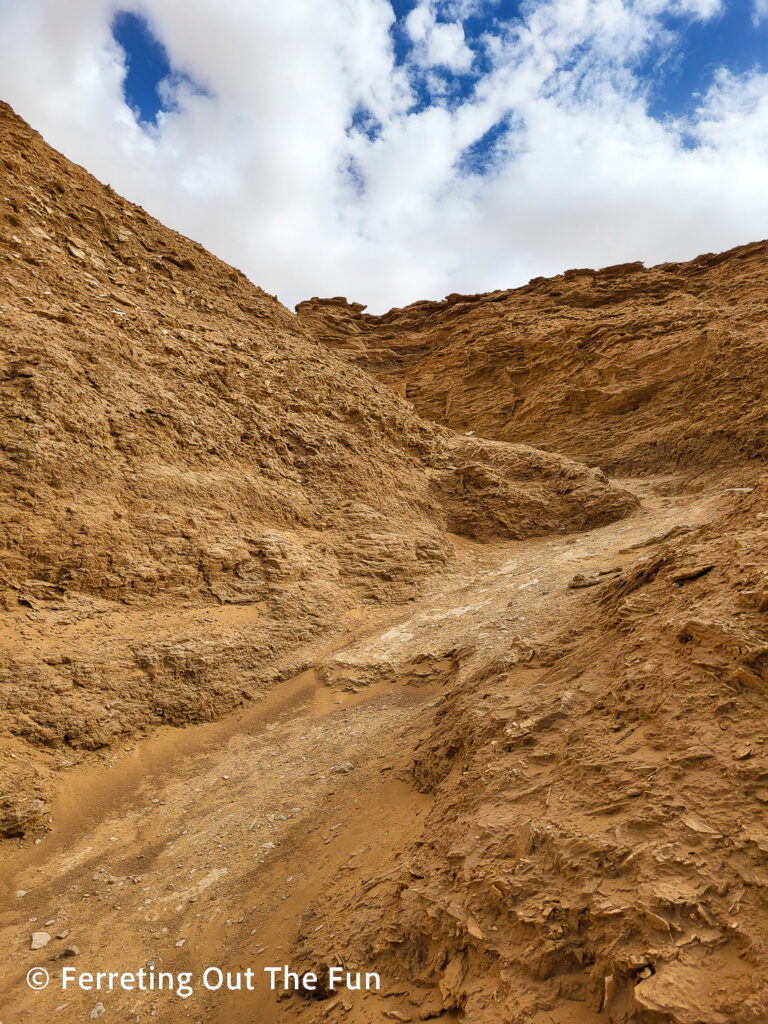 Climbing up a rocky hill in Ong Jemal, Tunisia