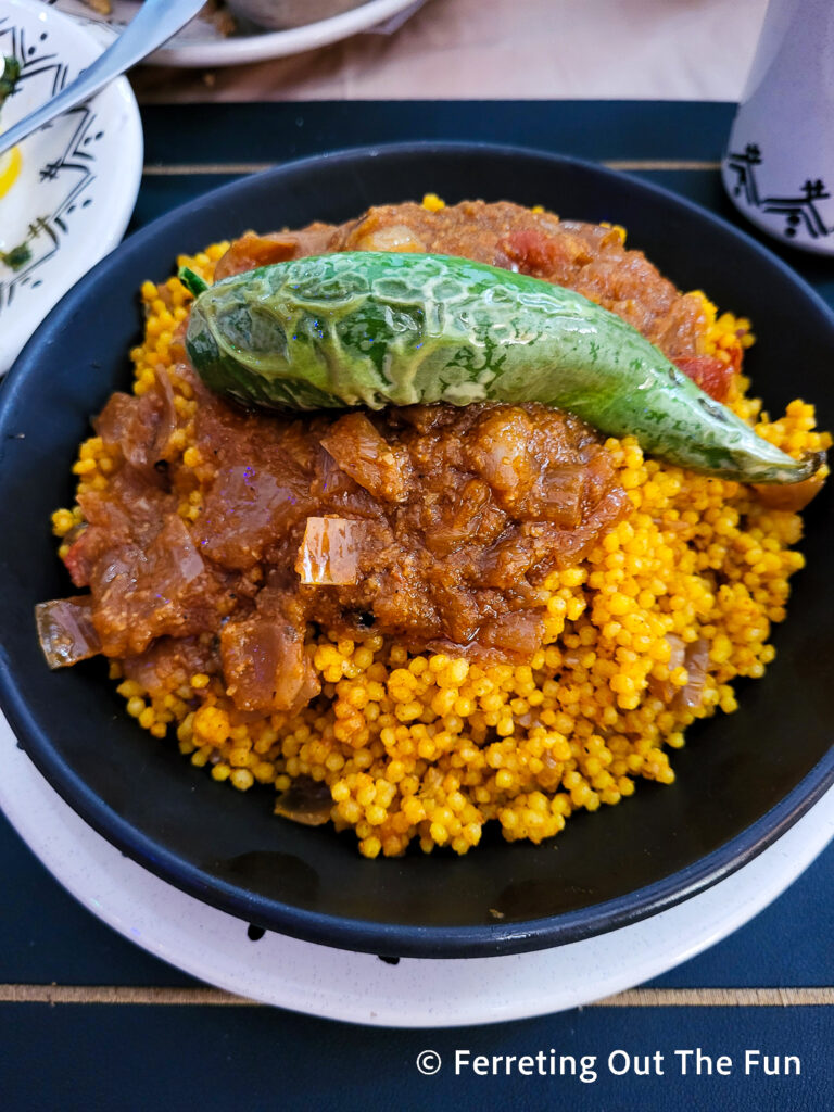 Vegetarian saffa, a specialty of Tozeur Tunisia. Pearl couscous, with savory tomato and onion sauce.