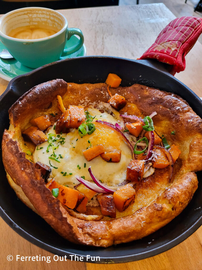 Dutch baby pancake with butternut squash, onions, and cheese at Zia Cafe Paris